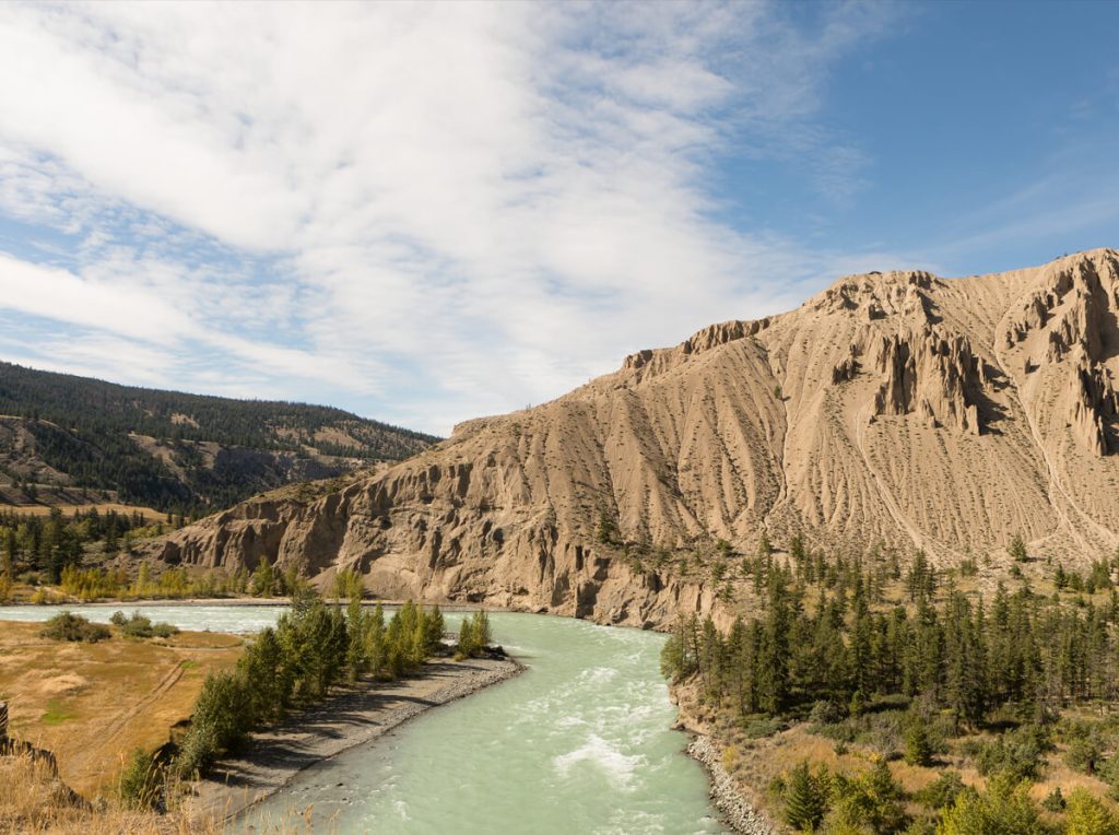 Desert mountain range along a river.